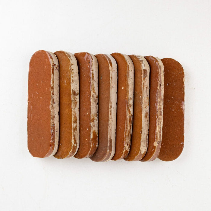 Lungarno - Zellige Bespoke - 2 " x 6" Ovals Glossy Terracotta Tile - Sundried Clay Stacked View
