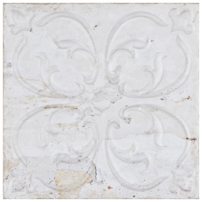 Decorative white tile with intricate patterns on a light background