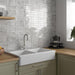 SomerTile - Coco 2 in. x 6 in. Glossy Porcelain Tile - Amber Grey wall installation